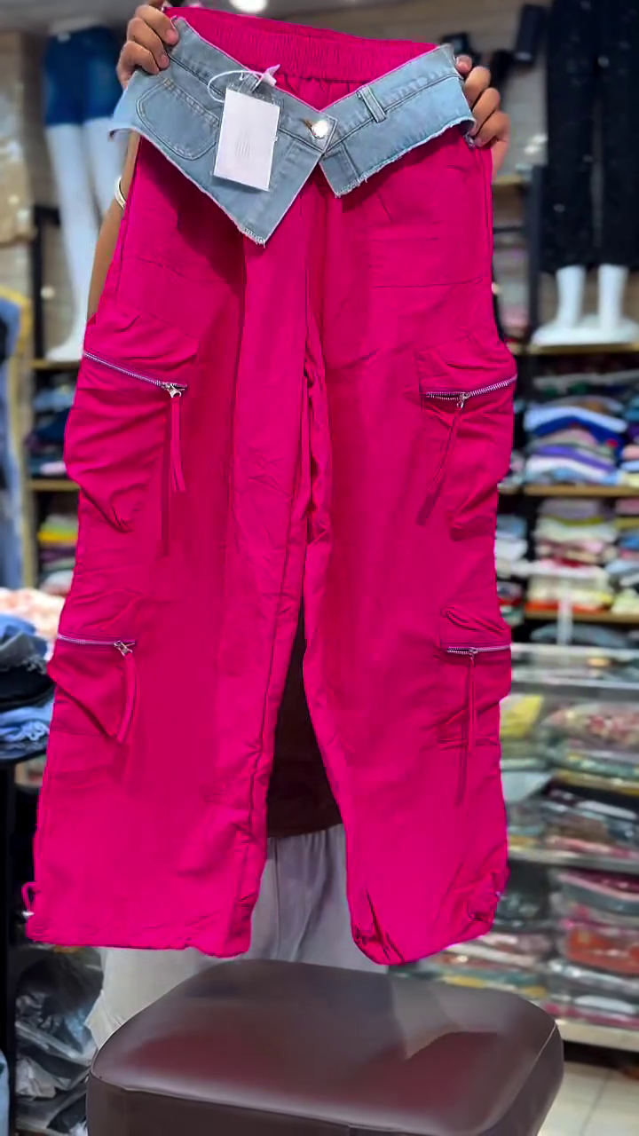 Trendy Hot Pink Cargo Pants Featuring Unique Contrast Denim Foldover Waistband and Multiple Zipper Pockets 👖