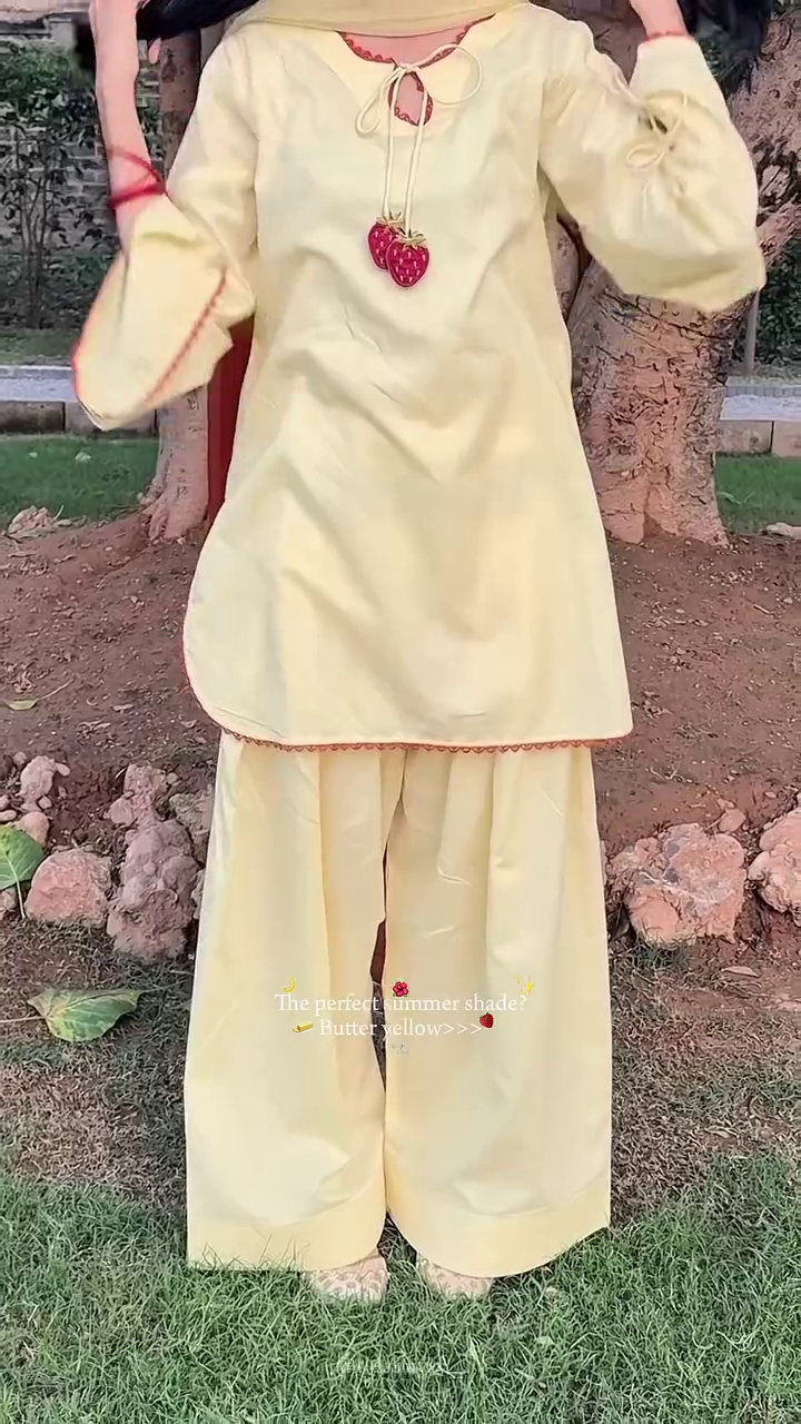 Elegant Butter Yellow Cotton Ethnic Suit Set Featuring Tie-Up Neckline with Strawberry Tassels and Matching Wide-Leg Palazzos 🍓