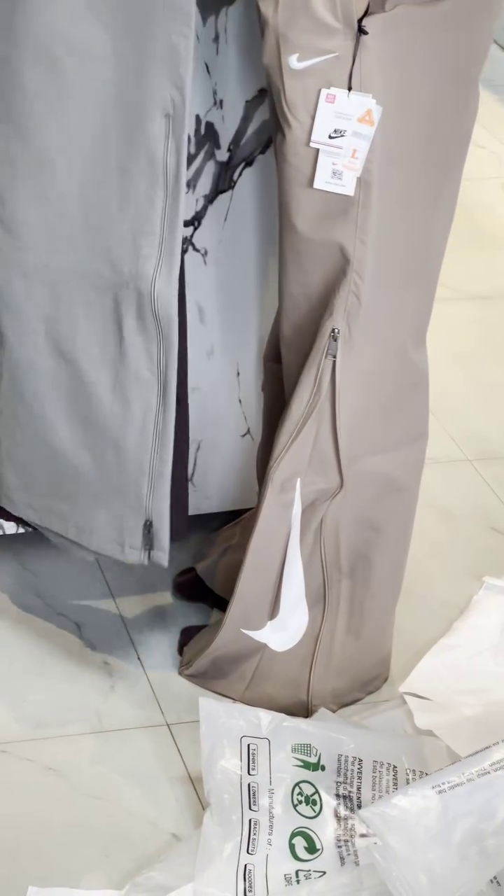 Premium Taupe Athletic Wide-Leg Track Pants with Side Zip Detail and Large White Swoosh Branding 🤍