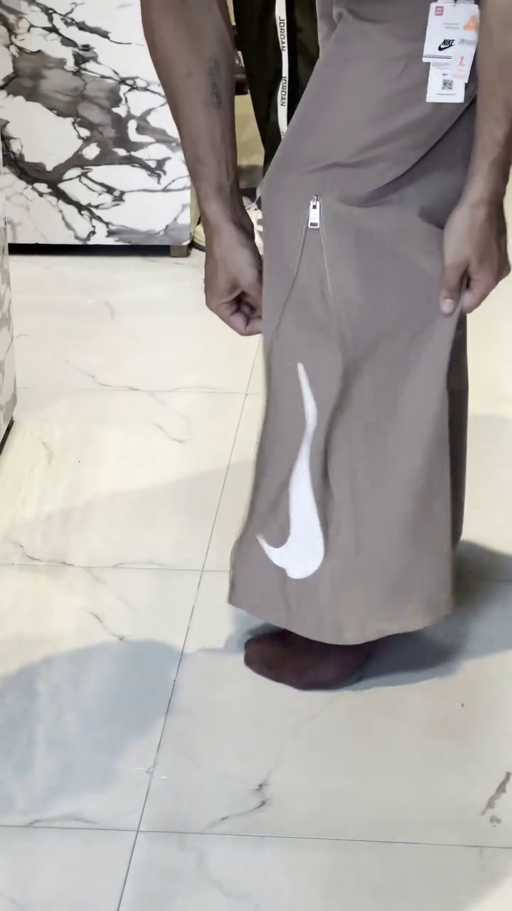 Premium Taupe Athletic Wide-Leg Track Pants with Side Zip Detail and Large White Swoosh Branding 🤍