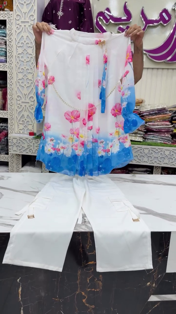 Vibrant Floral Gradient Chiffon Top With Chain Belt Detail Paired With White Cargo Pants 🌸💙🤍✨